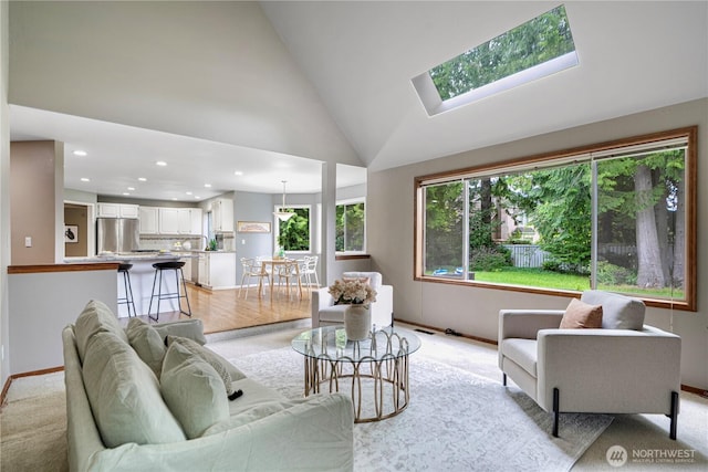 2110 216th Pl NE, Sammamish, WA 98074 - living area with lofted ceiling, recessed lighting, baseboards, and a skylight