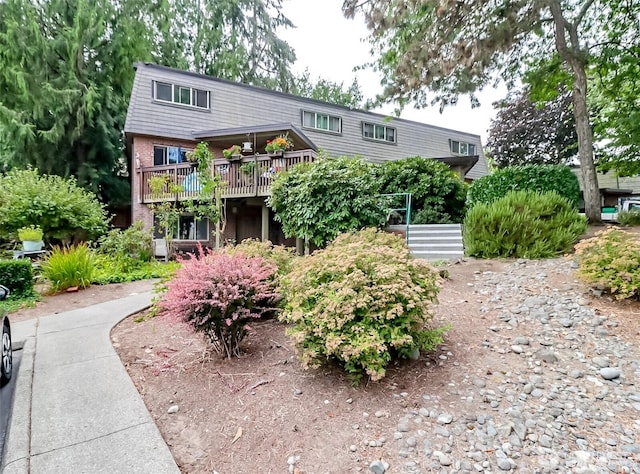 3834 175th Ave NE Unit G16, Redmond, WA 98052 - view of front of house featuring a wooden deck and brick siding