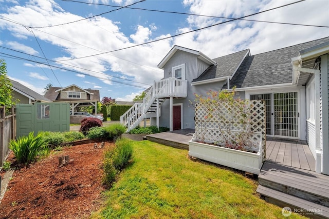 2828 Sunset Dr, Bellingham, WA 98225 - back of property featuring a wooden deck, roof with shingles, and stairway
