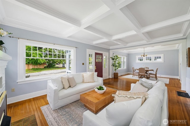 2828 Sunset Dr, Bellingham, WA 98225 - living area with a fireplace, baseboards, coffered ceiling, plenty of natural light, and wood finished floors