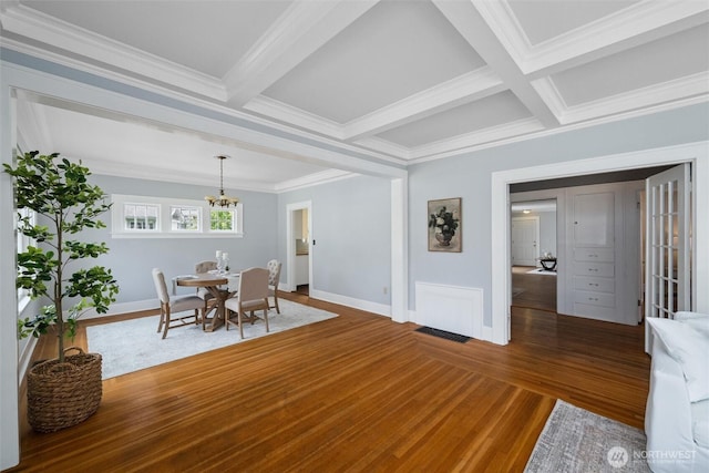 2828 Sunset Dr, Bellingham, WA 98225 - dining room featuring wood finished floors, a chandelier, beam ceiling, ornamental molding, and coffered ceiling