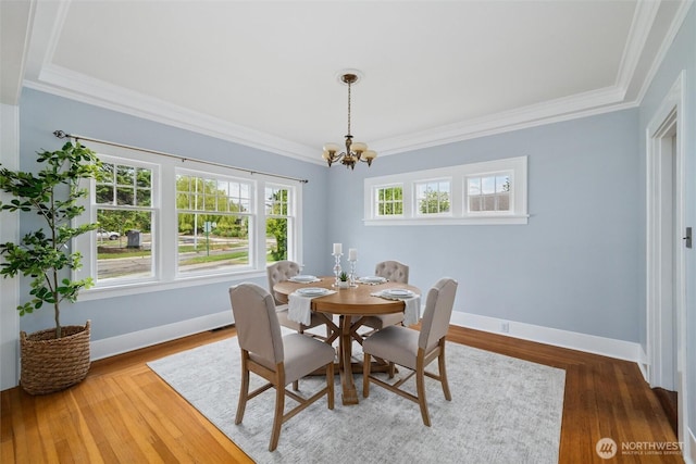 2828 Sunset Dr, Bellingham, WA 98225 - dining area featuring a chandelier, ornamental molding, baseboards, and wood finished floors