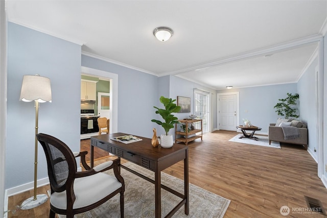 2828 Sunset Dr, Bellingham, WA 98225 - office area with light wood-type flooring, crown molding, and baseboards