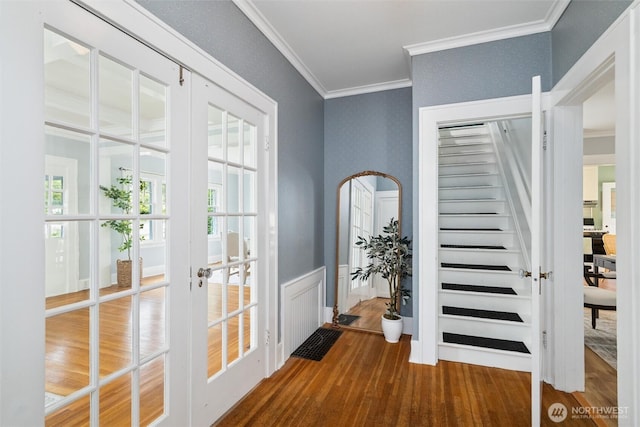 2828 Sunset Dr, Bellingham, WA 98225 - entryway with french doors, wood finished floors, ornamental molding, wainscoting, and stairs