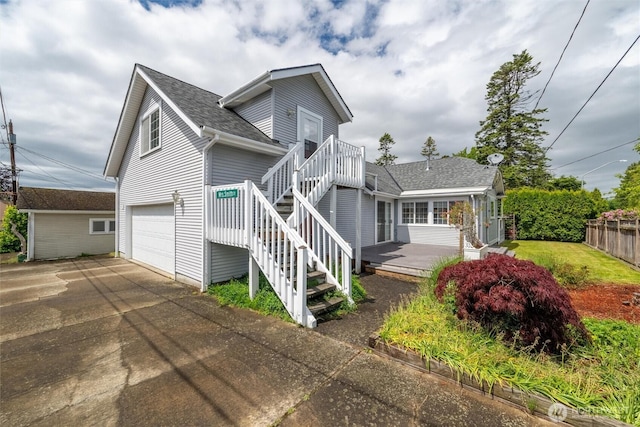 2828 Sunset Dr, Bellingham, WA 98225 - view of side of home with a shingled roof, driveway, and an attached garage