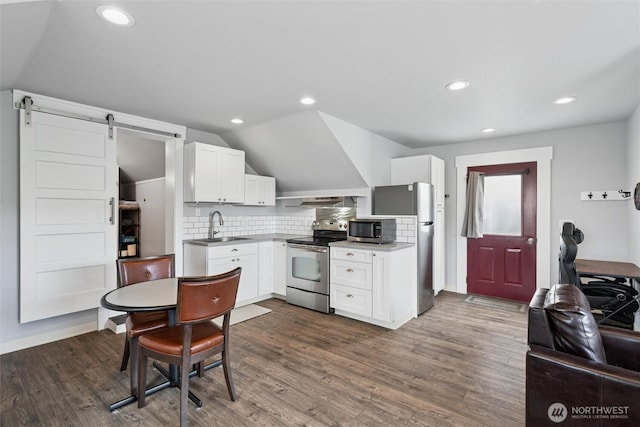 2828 Sunset Dr, Bellingham, WA 98225 - kitchen featuring appliances with stainless steel finishes, white cabinetry, a sink, backsplash, and dark wood finished floors