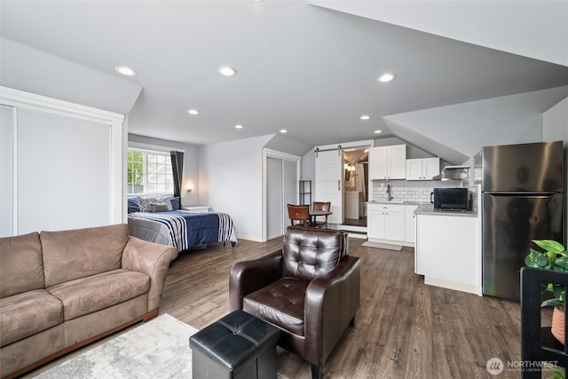 2828 Sunset Dr, Bellingham, WA 98225 - living room featuring dark wood-type flooring and recessed lighting