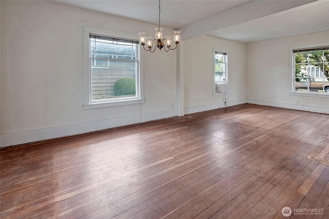 4604SW Lander St, Seattle, WA 98116 - empty room with a chandelier, wood-type flooring, and baseboards