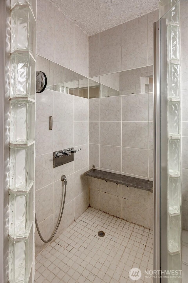 4604SW Lander St, Seattle, WA 98116 - full bath with a stall shower, a textured ceiling, and tile patterned flooring