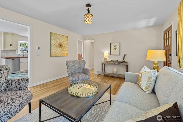 7510 Fauntleroy Way SW, Seattle, WA 98136 - living room with light wood-type flooring and baseboards