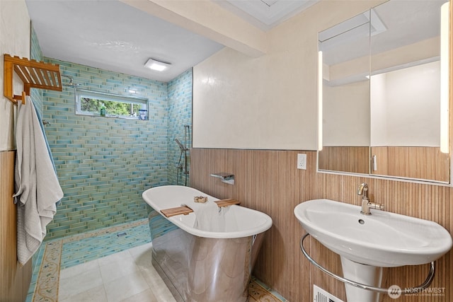 7510 Fauntleroy Way SW, Seattle, WA 98136 - full bathroom with wainscoting, a soaking tub, a sink, and tiled shower