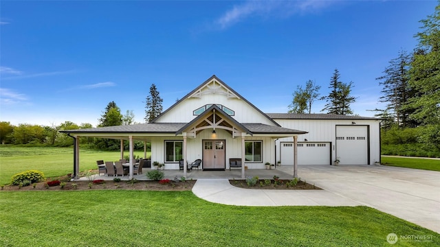 2495 River Rock Dr, Everson, WA 98247 - view of front of property with a front lawn, concrete driveway, a porch, a shingled roof, and board and batten siding