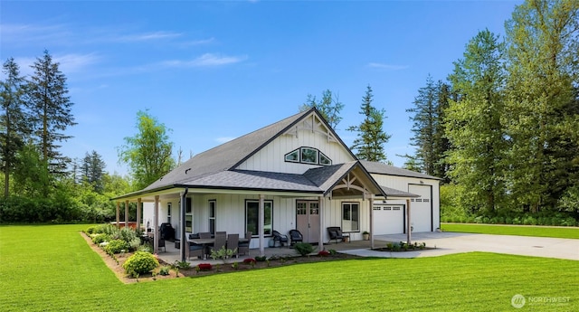 2495 River Rock Dr, Everson, WA 98247 - view of front of home with concrete driveway, a garage, a front lawn, a porch, and a shingled roof