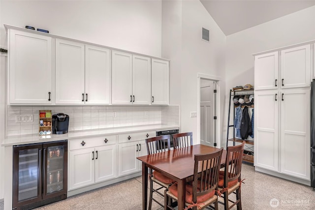2495 River Rock Dr, Everson, WA 98247 - dining room with wine cooler and high vaulted ceiling