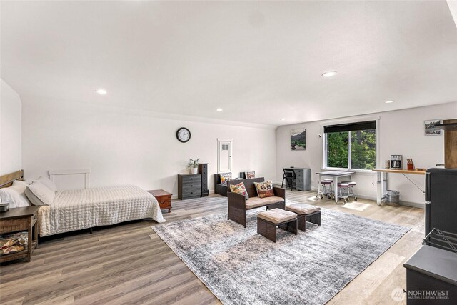 2495 River Rock Dr, Everson, WA 98247 - bedroom featuring recessed lighting, light wood-style flooring, and a wood stove