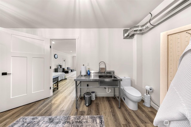 2495 River Rock Dr, Everson, WA 98247 - bathroom featuring a sink, wood finished floors, and toilet