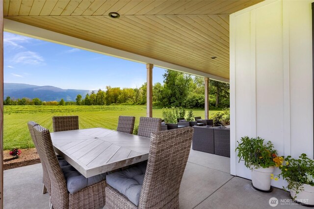 2495 River Rock Dr, Everson, WA 98247 - view of patio / terrace featuring a mountain view, outdoor dining area, and an outdoor living space