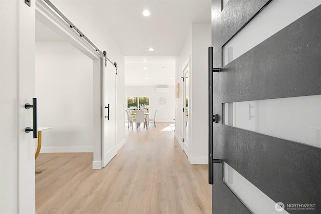 710 E 4th St, Nooksack, WA 98276 - hallway featuring recessed lighting, a barn door, light wood-style floors, and baseboards