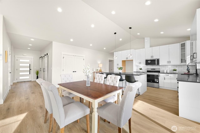 710 E 4th St, Nooksack, WA 98276 - dining room featuring vaulted ceiling, light wood finished floors, and recessed lighting