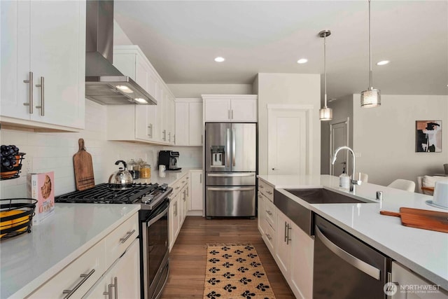 18621 135th Ln E, Bonney Lake, WA 98391 - kitchen featuring appliances with stainless steel finishes, wall chimney exhaust hood, a sink, light countertops, and white cabinetry