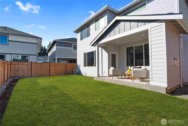 18621 135th Ln E, Bonney Lake, WA 98391 - rear view of property featuring board and batten siding, outdoor lounge area, a patio, and central AC unit