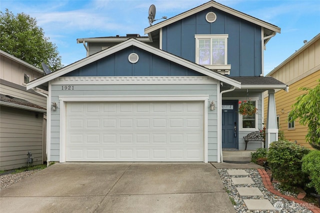 1921 76th Ave SE, Lake Stevens, WA 98258 - traditional home with concrete driveway, board and batten siding, and a garage