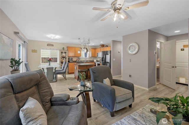 1921 76th Ave SE, Lake Stevens, WA 98258 - living room with light wood-style flooring, baseboards, ceiling fan, and recessed lighting