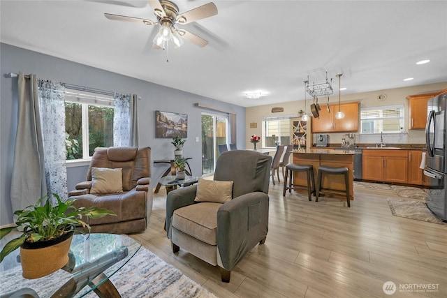 1921 76th Ave SE, Lake Stevens, WA 98258 - living room featuring ceiling fan, light wood-style floors, and recessed lighting