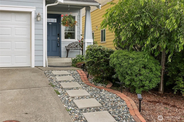 1921 76th Ave SE, Lake Stevens, WA 98258 - property entrance with a garage, roof with shingles, and concrete driveway