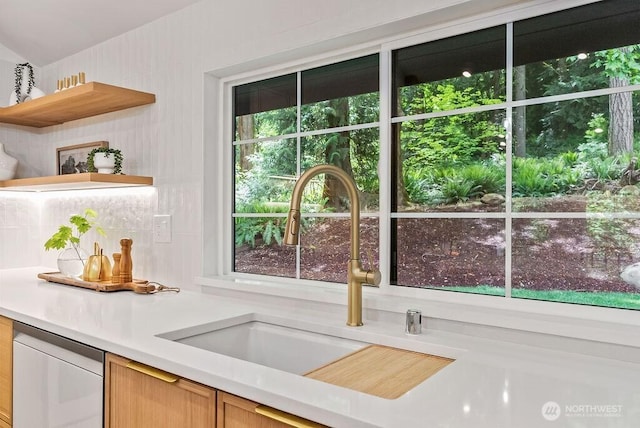 19433 SE 128th St, Renton, WA 98059 - kitchen featuring dishwasher, open shelves, a sink, light countertops, and backsplash