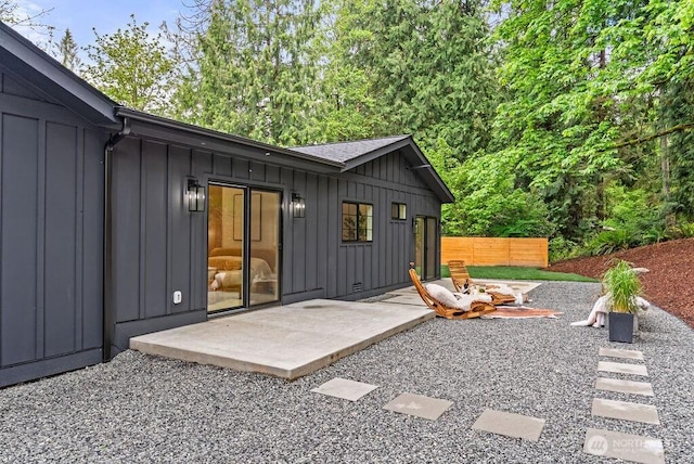 19433 SE 128th St, Renton, WA 98059 - back of property with board and batten siding and a patio area