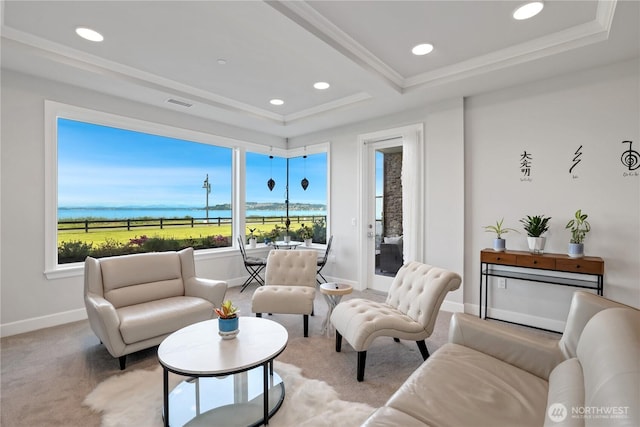 4907 Main St Unit 107, Tacoma, WA 98407 - carpeted living area with a tray ceiling, baseboards, a water view, recessed lighting, and ornamental molding