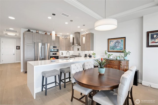4907 Main St Unit 107, Tacoma, WA 98407 - dining space featuring recessed lighting, light wood-type flooring, crown molding, and baseboards