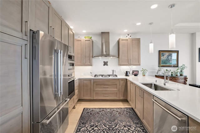 4907 Main St Unit 107, Tacoma, WA 98407 - kitchen featuring stainless steel appliances, a sink, wall chimney exhaust hood, light wood-type flooring, and light countertops