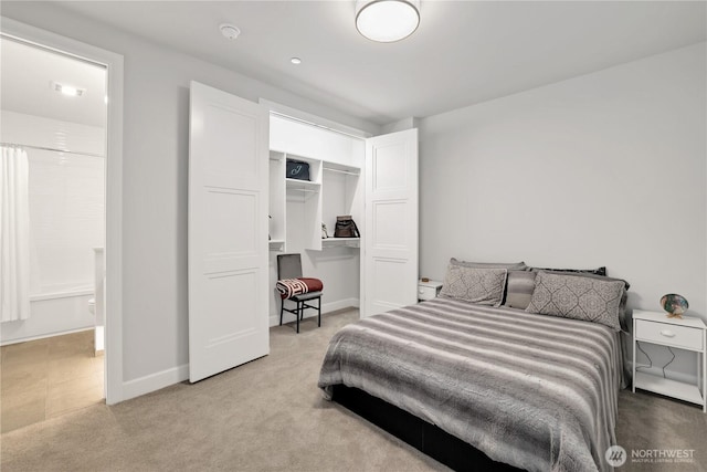 4907 Main St Unit 107, Tacoma, WA 98407 - carpeted bedroom featuring a closet and baseboards