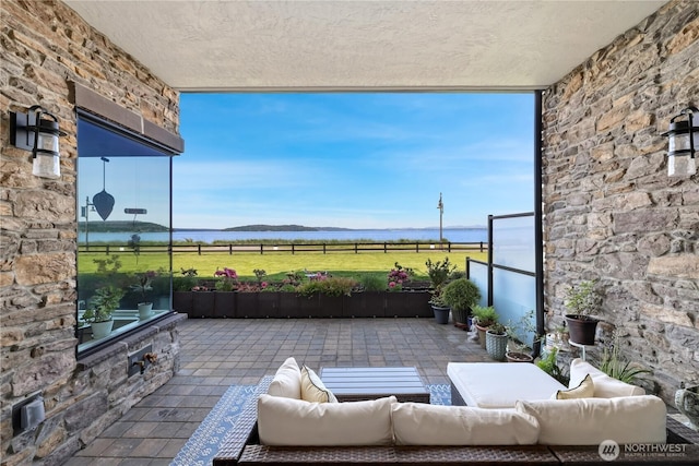 4907 Main St Unit 107, Tacoma, WA 98407 - view of patio featuring a water view and an outdoor living space