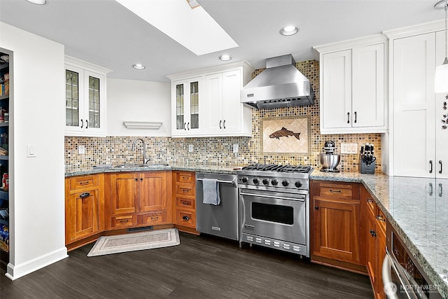 5758 Overlook Ave NE, Tacoma, WA 98422 - kitchen featuring appliances with stainless steel finishes, wall chimney range hood, a sink, a skylight, and glass insert cabinets