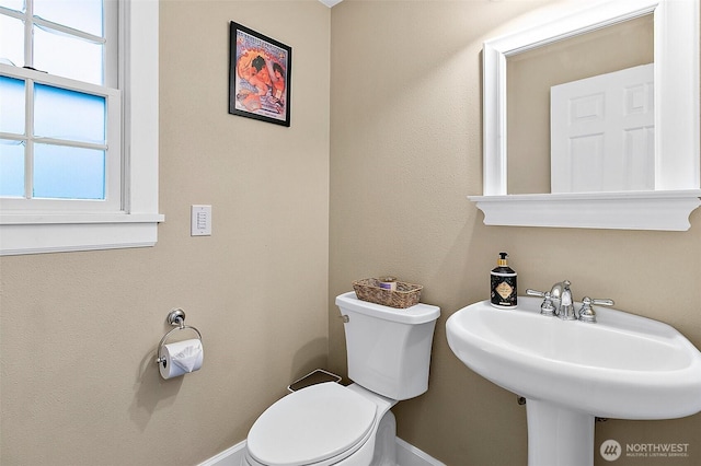 5758 Overlook Ave NE, Tacoma, WA 98422 - half bath with toilet, baseboards, and a sink