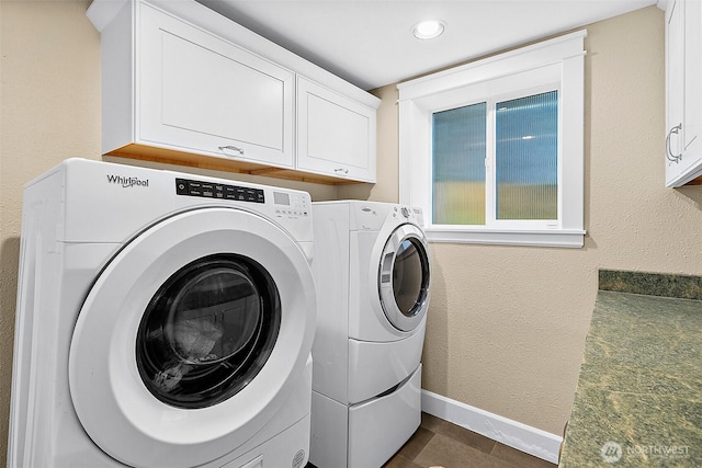 5758 Overlook Ave NE, Tacoma, WA 98422 - washroom featuring washer and clothes dryer, cabinet space, and baseboards