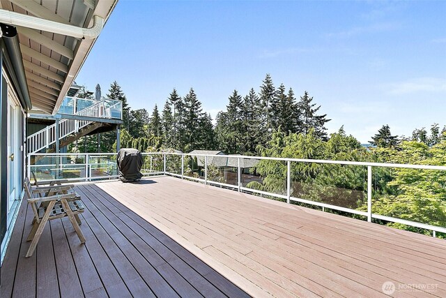 5758 Overlook Ave NE, Tacoma, WA 98422 - wooden deck with stairway and view of wooded area