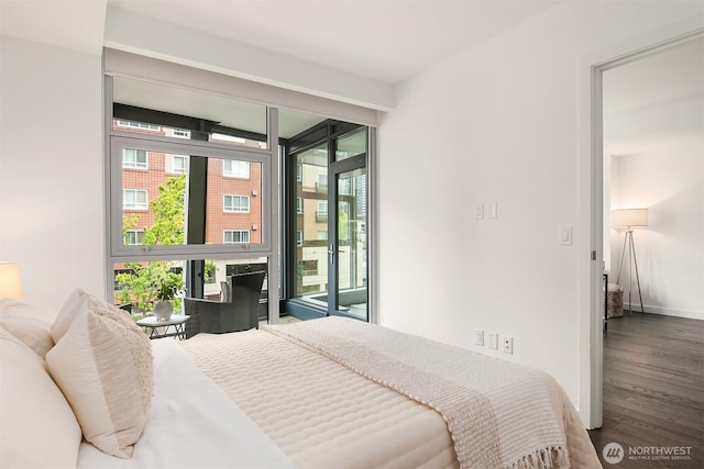 188 Bellevue Way NE Unit 307, Bellevue, WA 98004 - bedroom with access to outside, wood finished floors, and baseboards