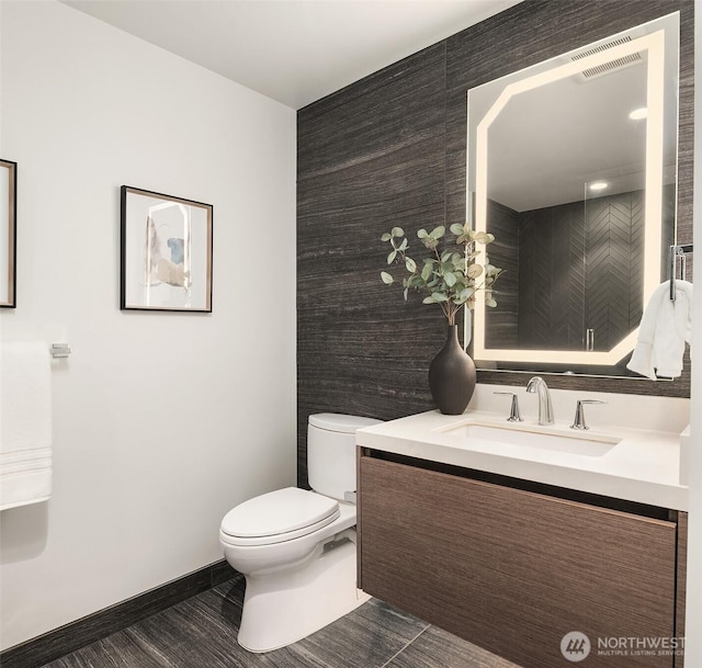 188 Bellevue Way NE Unit 307, Bellevue, WA 98004 - bathroom featuring toilet, vanity, and baseboards