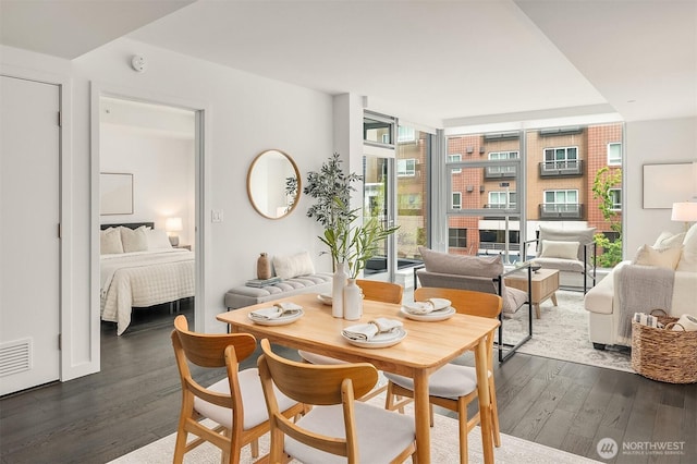 188 Bellevue Way NE Unit 307, Bellevue, WA 98004 - dining area featuring dark wood-style floors and a wall of windows