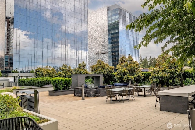 188 Bellevue Way NE Unit 307, Bellevue, WA 98004 - view of patio / terrace featuring outdoor dining area