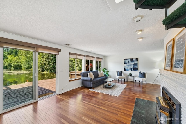 35029 37th Ave S, Auburn, WA 98001 - living area featuring a textured ceiling and wood finished floors