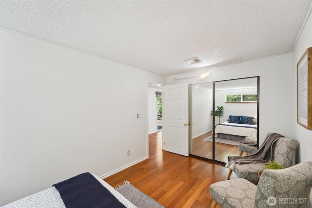35029 37th Ave S, Auburn, WA 98001 - bedroom with wood finished floors and a textured ceiling