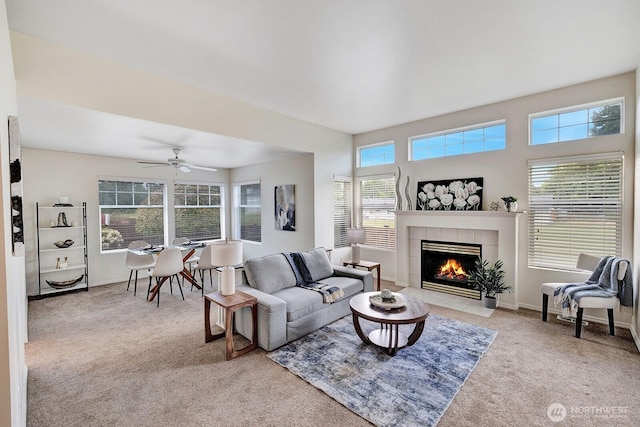 7407 143rd Avenue Ct E, Sumner, WA 98390 - carpeted living area featuring a fireplace, ceiling fan, and baseboards