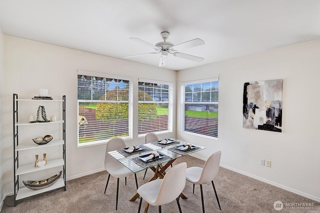7407 143rd Avenue Ct E, Sumner, WA 98390 - dining room with carpet flooring, baseboards, and a ceiling fan