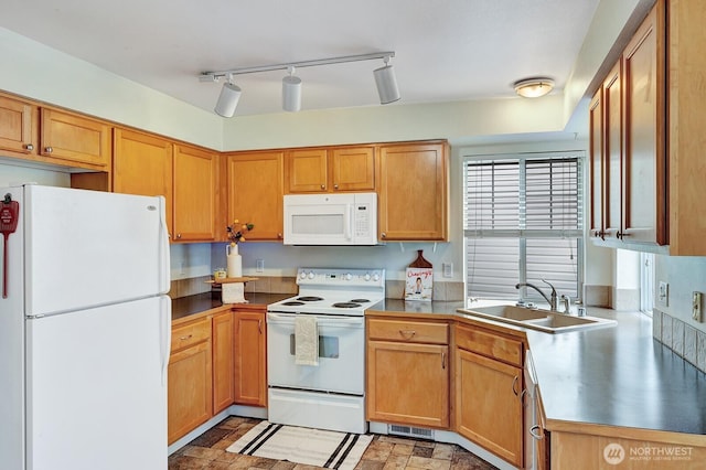 7407 143rd Avenue Ct E, Sumner, WA 98390 - kitchen featuring white appliances and a sink