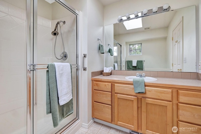 7407 143rd Avenue Ct E, Sumner, WA 98390 - full bath with a skylight, a stall shower, and vanity